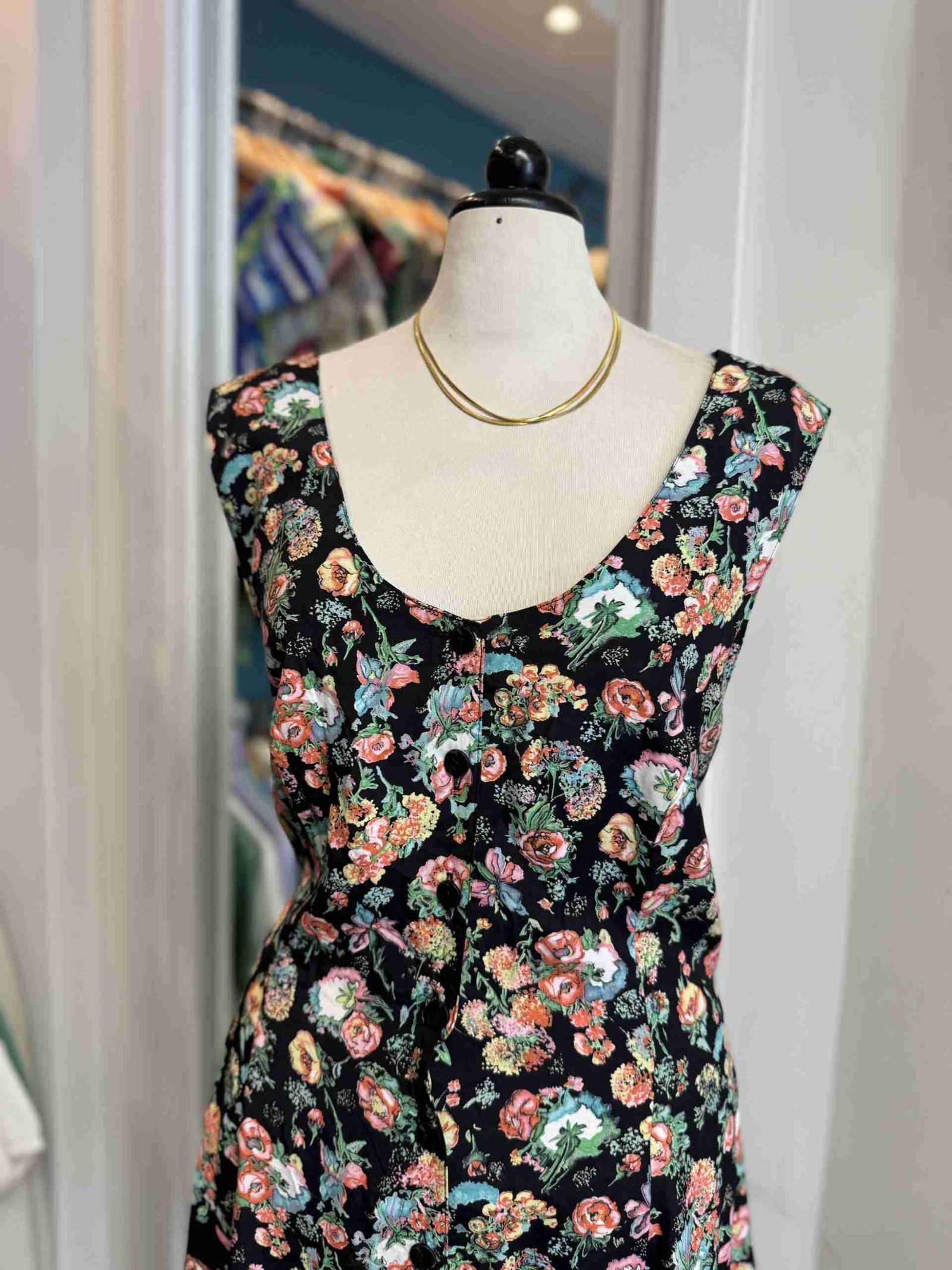 Vestito nero floreale incrociato